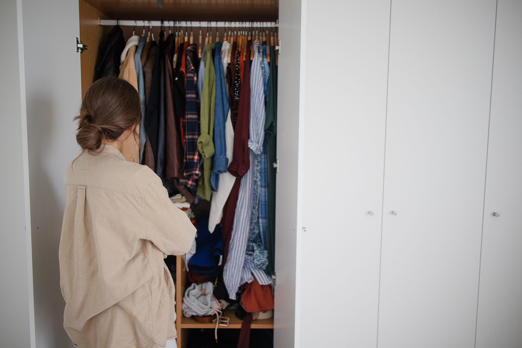 Woman Decluttering a Closet